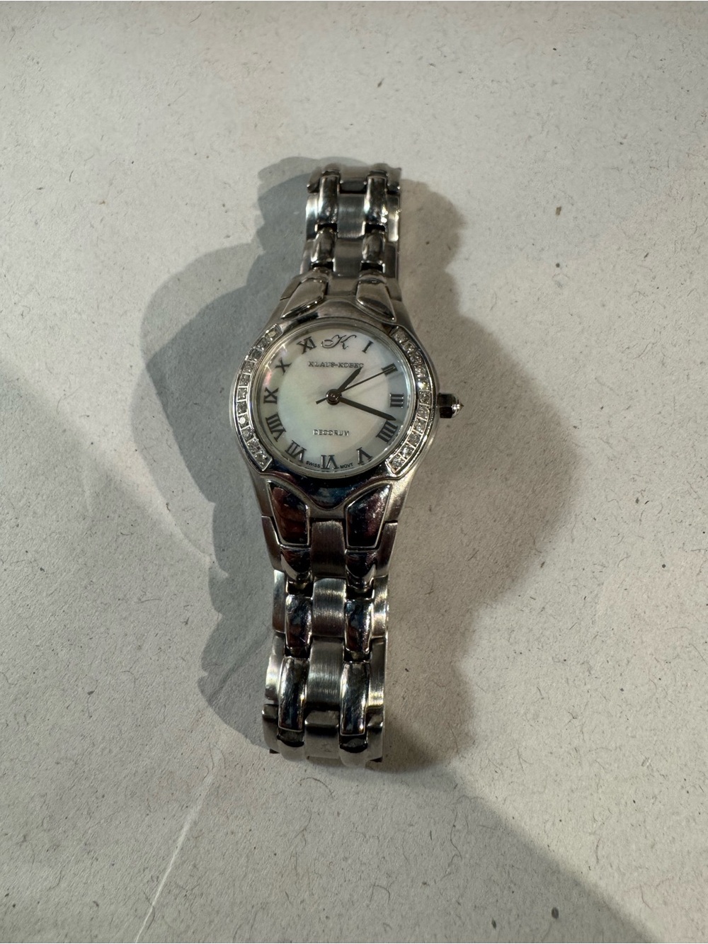 Preowned Elegant Klaus Kobec Women's
Diamond Watch Swiss movement NEEDS battery